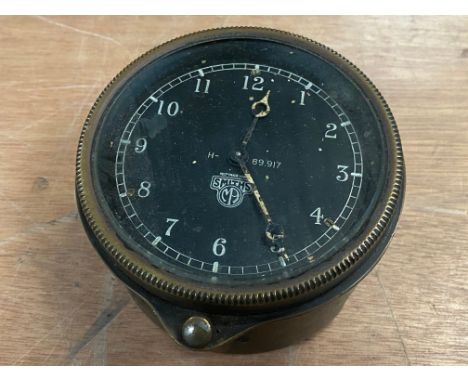 A Smiths black faced rim wind clock. 