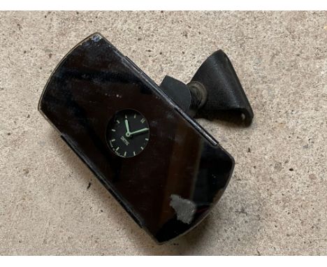 A Smiths interior rear view mirror with clock insert and fittings. 