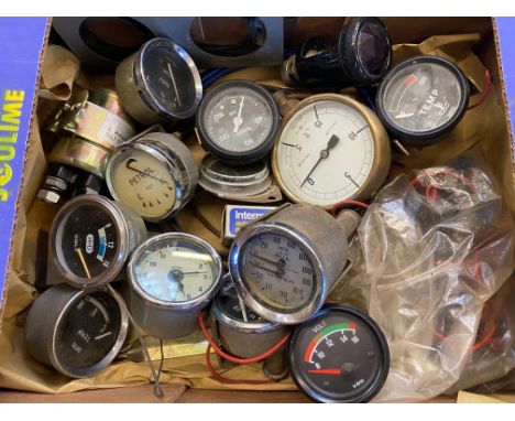 A collection of gauges including a Smiths oil and water gauge plus a Lucas AT20 IL tail light. 