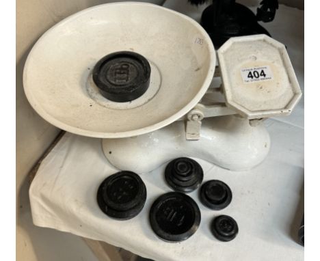 A set of cast iron kitchen scales &amp; weights