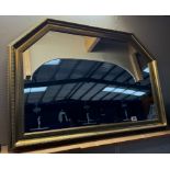 A large gilt framed mirror