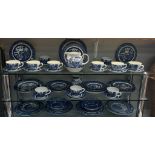 A blue & white willow pattern dinner set by Churchill & A quantity of other blue & white dinner