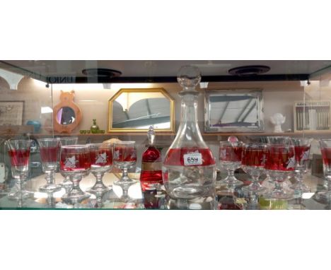 A decanter, Two lots of six matching glasses &amp; An ornate bell