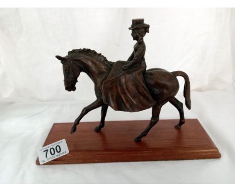 A bronze Edwardian dressed lady on horse