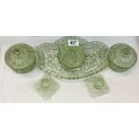 A vintage green glass dressing table set