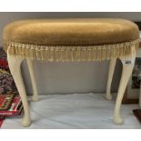 A vintage dressing table stool