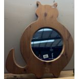 A large pine framed cat shaped mirror