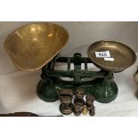 A pair of cast iron kitchen scales with brass pans