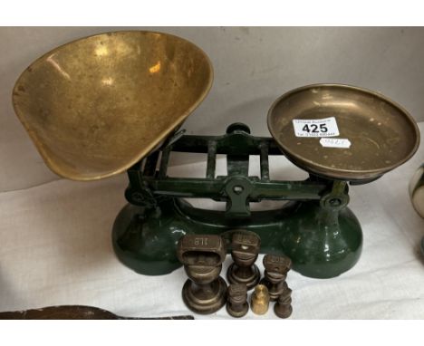 A pair of cast iron kitchen scales with brass pans