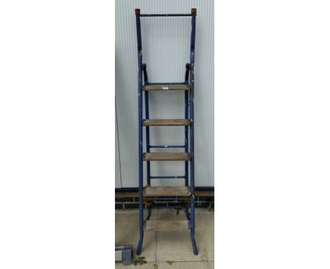 An aluminium step ladder with wooden steps