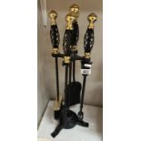 An iron fire place companion set