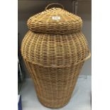 A large Ali-Baba style wicker laundry basket