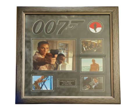 Daniel Craig 007 James Bond signed colour photo montage. Mounted and framed, measures 25x24 inch appx. Frame glass intact. Da