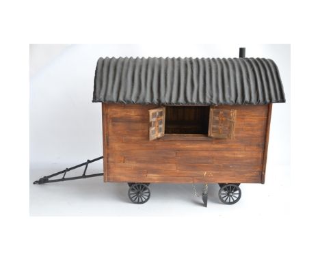 Large homemade wooden shepherds hut model with removeable roof to reveal detailed interior complete with a box of accessories