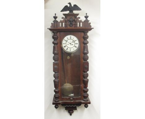 Gustav Becker - early C20th walnut Vienna wall clock, eagle pediment over full length glazed door flanked by applied half tur