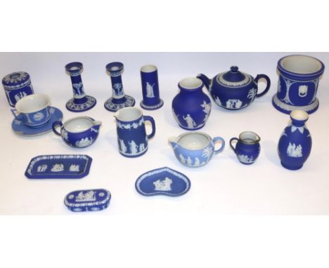 Collection of Wedgwood dipped blue jasperware, incl. teapot, pair of candlesticks, four jugs, cup and saucer, trinket dishes,