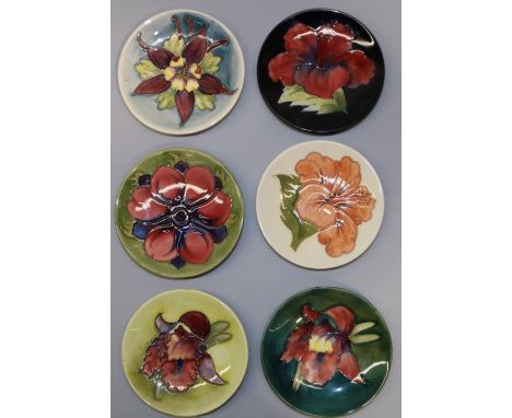 Moorcroft Pottery: six pin dishes/coasters - anemone on light green ground; columbine on graduated blue ground; 2x hibiscus; 