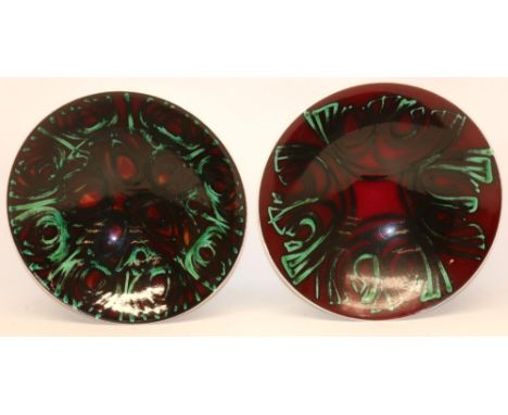 Two large Poole Pottery bowls, decorated with black and turquoise geometric designs on a burgundy ground, both D35cm (2) 