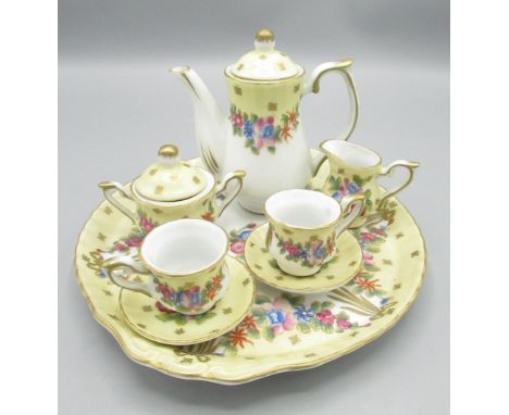 German miniature coffee set comprising tray, coffee pot, milk/cream jug, sugar bowl and 2 cups and saucers (8)