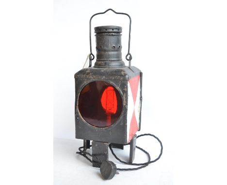 An attractive vintage German Caboose lantern with fitted modern mains powered lighting. Height approx 45cm with stowed handle