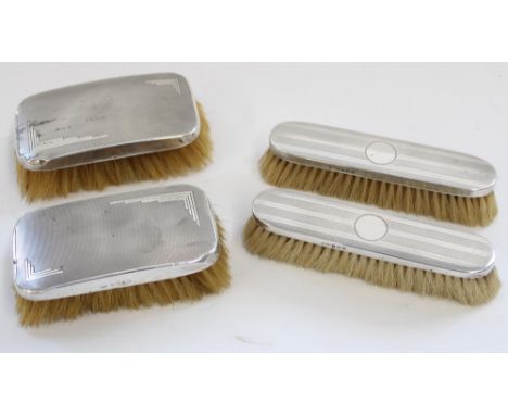 Four c1920s to 1930s hallmarked silver dressing table brushes with engine turned decoration, max W15cm (4) 