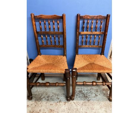 Set of six elm bobbin back rush seat dining chairs, on turned supports with stretchers and pad feet, (6) 