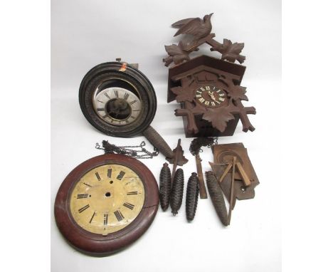 C20th Black Forest cuckoo clock with triple weight driven movement and an early C20th continental postman's alarm wall clock 