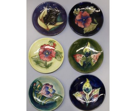 Moorcroft Pottery: six pin dishes/coasters - red pansy on light green ground; crocus on graduated green ground; red pansy on 