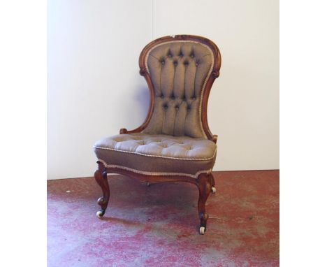 Victorian walnut lady's button-back chair with carved frame, serpentine cushioned seat, raised on cabriole legs terminating i