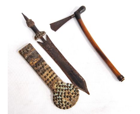 Tribal Polynesian axe with wooden handle and etched fan-shaped blade, together with a knife with stud and hide scabbard.&nbsp