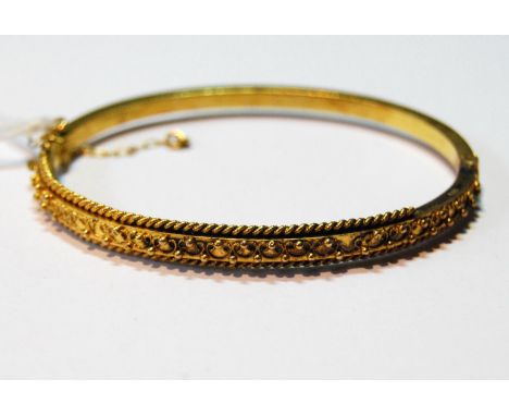 Victorian gold hinged bangle, probably 15ct, 8.8g. 
