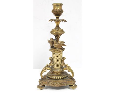 19th century gilt metal candlestick with pierced ivory column surmounted by two birds, trefoil base with scroll supports, 25c