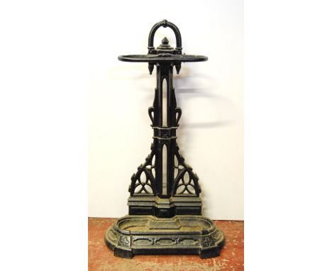 Victorian cast iron stick stand with pierced column over drip tray, with stamps, 72cm high, and 40cm wide. 