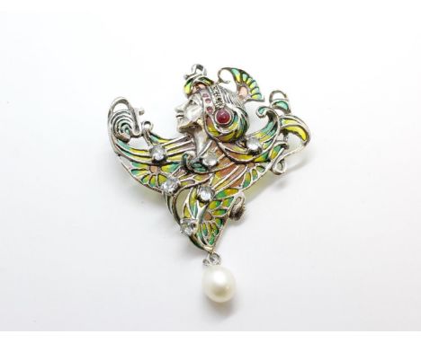 Art Nouveau style brooch/pendant depicting a lady in headdress set with cabochon ruby, topaz, rubies, marcasite and plique-à-