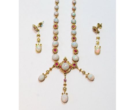 Victorian gold necklace with graduated opal and ruby clusters, with similar drops, and a pair of drop earrings, each with an 