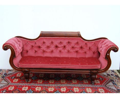 19th century button-back sofa, the stepped mahogany top rail over scroll arms, loose cushioned seat, raised on tapering octag