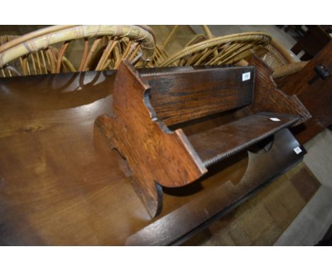 An Arts and Crafts style dark oak book trough