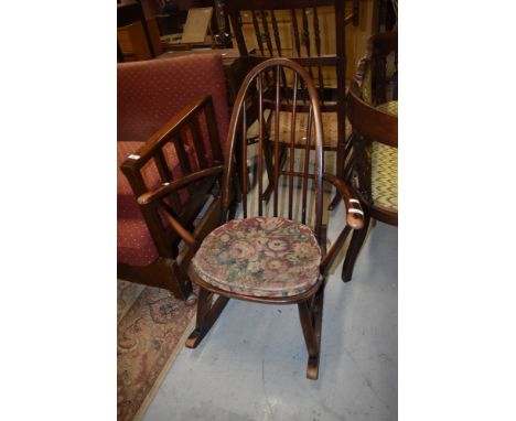 An Ercol or similar hoop and stick back rocking chair, stamped to base BS1060 KF2056