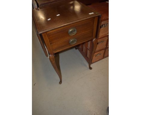 An early 20th Century mahogany and inlaid side table having drop flaps and two frieze drawers