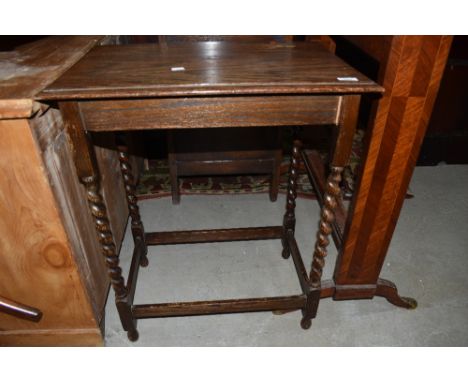 An early 20th Century oak twist leg side table