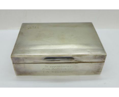 A silver cigarette box, with inscription, width 12.5cm 