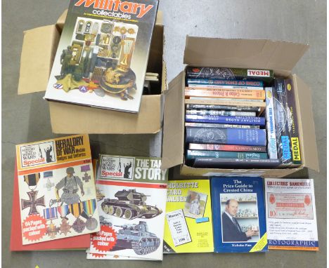 Two boxes of collectors price guide books including coins, medals, military, bank notes and first day covers, etc. **PLEASE N