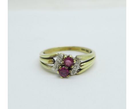 An 8ct gold ring set with six diamonds and two rubies, marked 333, 2.4g, M 