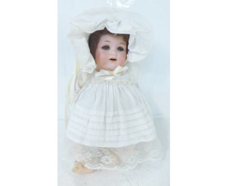 A German Armand Marseille bisque head doll with blue sleep eyes, 990 O ½ M identification mark, circa 1910-1920's, 34cm