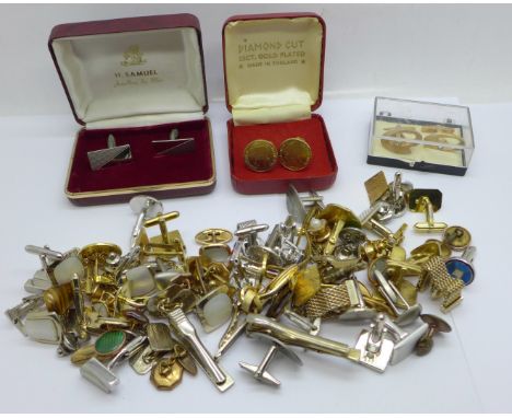 A collection of cufflinks and tie-pins 