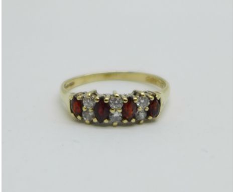 A 9ct gold, garnet and white stone ring, 1.6g, M 