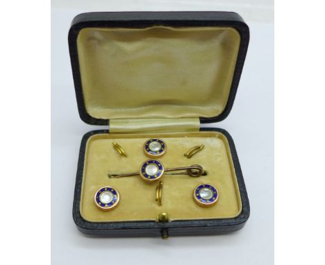 A blue enamel and pearl brooch and three button set, cased 