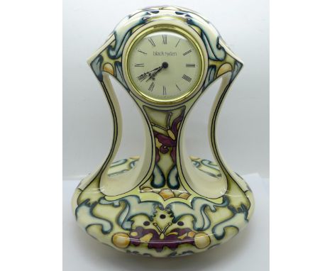 A Moorcroft Black Ryden tube lined clock, 25cm 