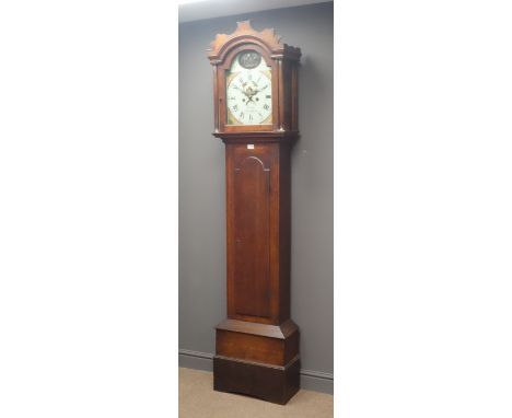 Early 19th century oak longcase clock, stepped arch trunk door, painted enamel dial with cottage scene, Roman and Arabic nume