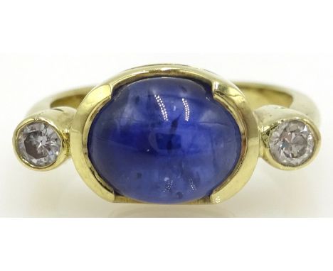 Gold ring set with cabochon sapphire and two diamonds, gold tested 14ct Condition Report Approx 5.6gm, Size MClick here for f